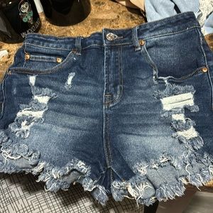 High waisted distressed blue Jean shorts